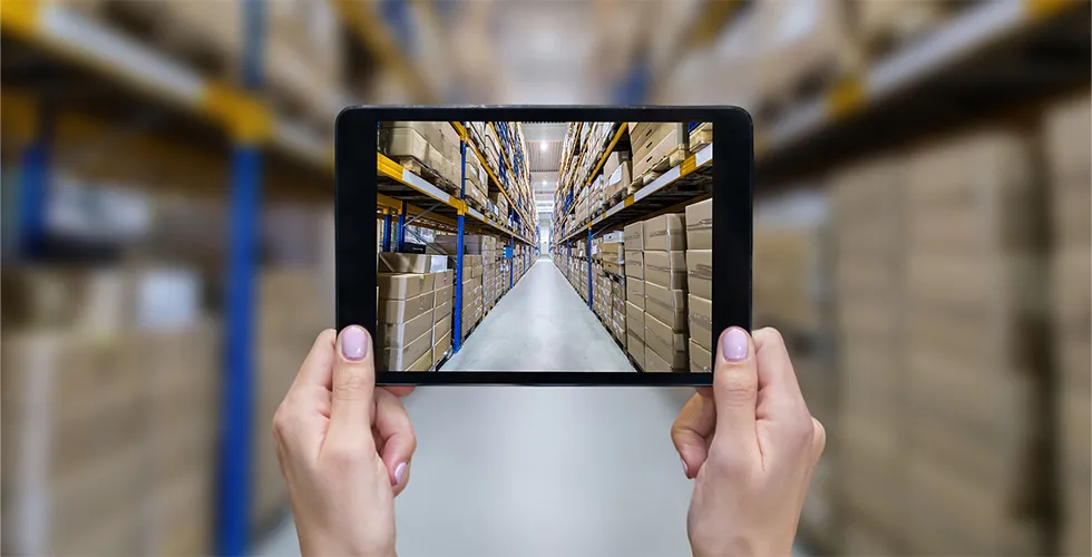 A tablet on which you can see a high-bay warehouse.