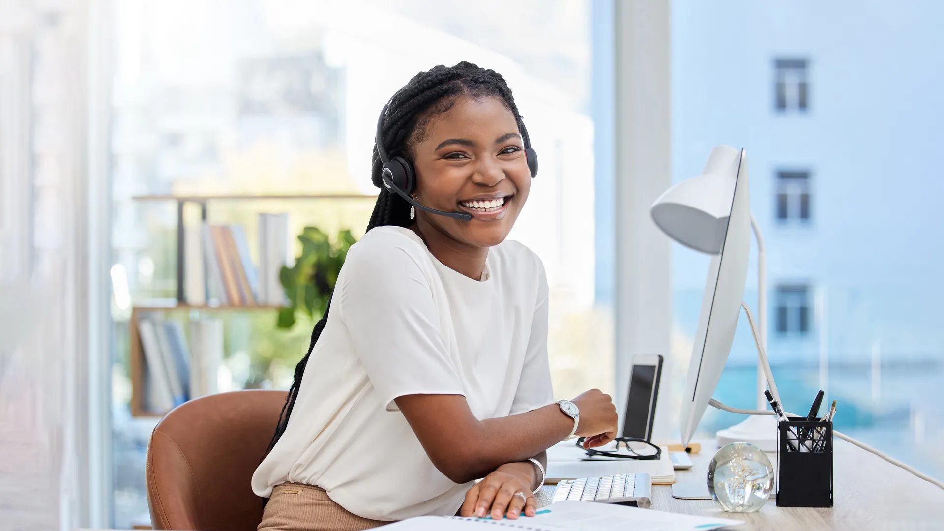 Smiling woman with headset at translation company tolingo
