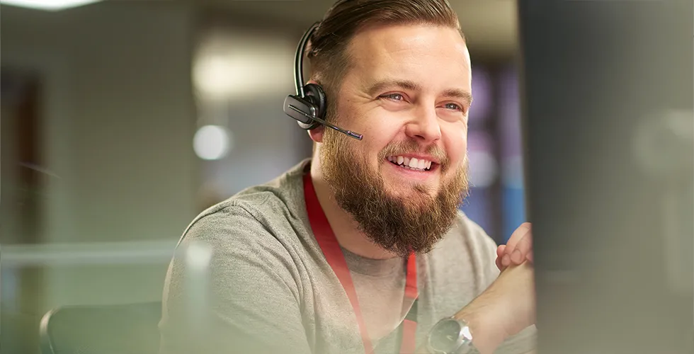 A service employee helps with an order for a Danish translation