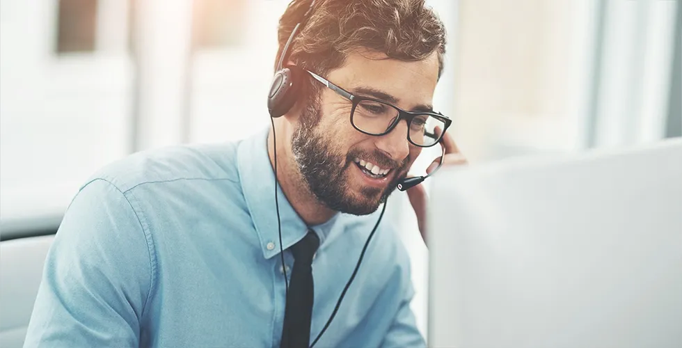 A service employee helps with an order for a Spanish translation